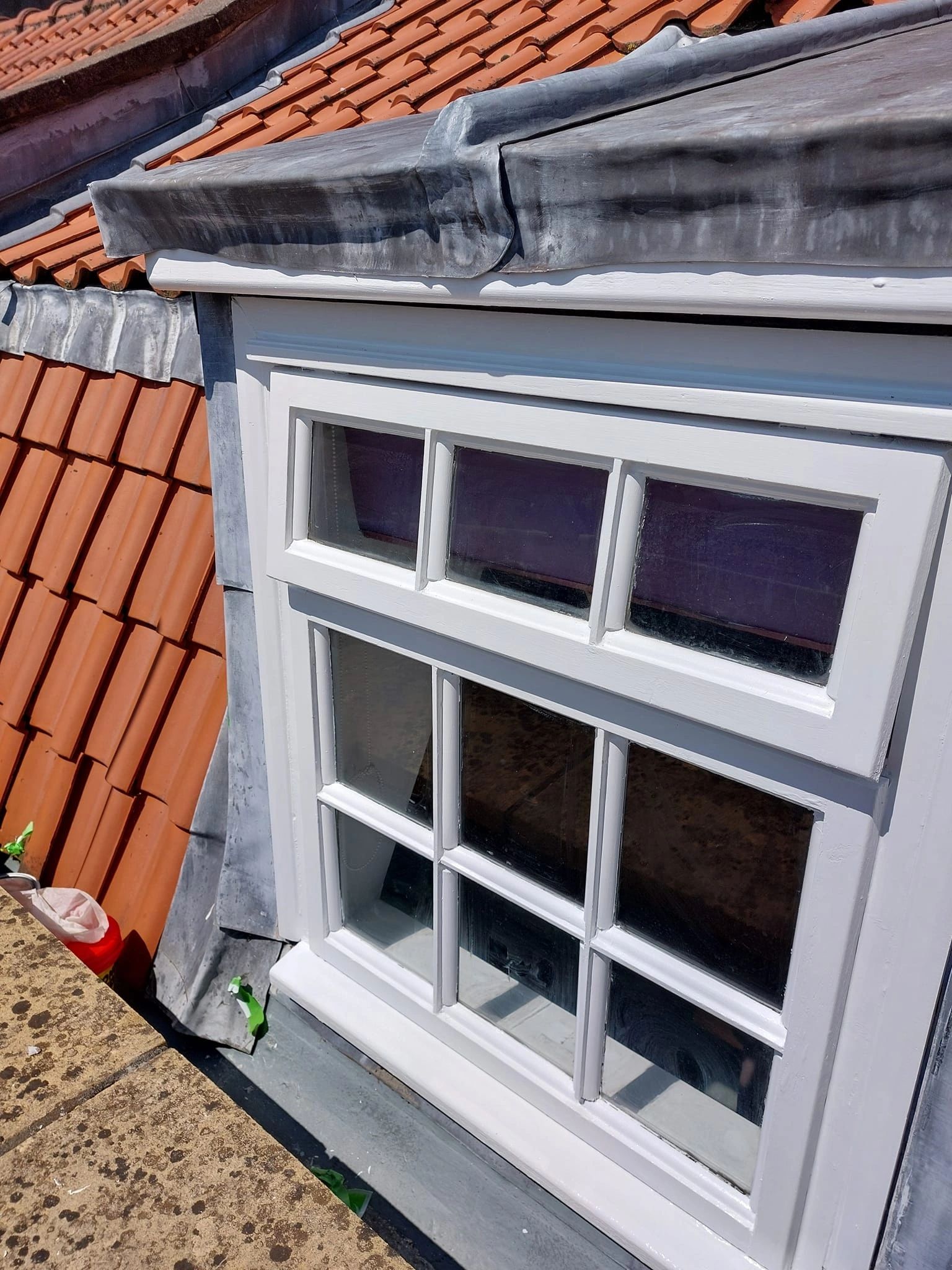 Restored sash window frame with fresh exterior paint